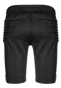 Pantalones cortos negros con una cinturilla acanalada y detalles texturizados en los paneles laterales. Tejido suave con un corte ajustado, diseño a la altura de la rodilla.