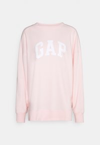 Felpa rosa con maniche lunghe, scollo rotondo e logo "GAP" bianco sul petto. Realizzata in stoffa morbida con una vestibilità comoda.