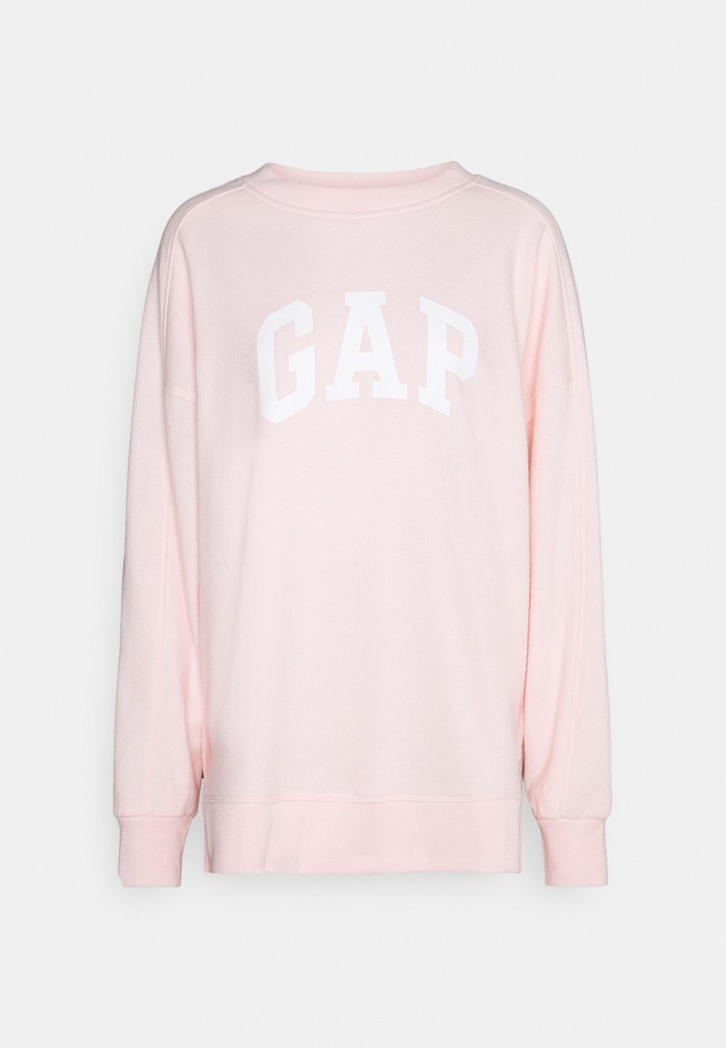 Felpa rosa con maniche lunghe, scollo rotondo e logo "GAP" bianco sul petto. Realizzata in stoffa morbida con una vestibilità comoda.