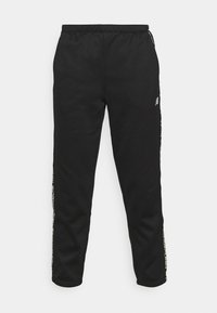 Zwarte sweatpants met een elastische tailleband, taps toelopende benen en witte branding langs de zijkant, gemaakt van zacht materiaal.