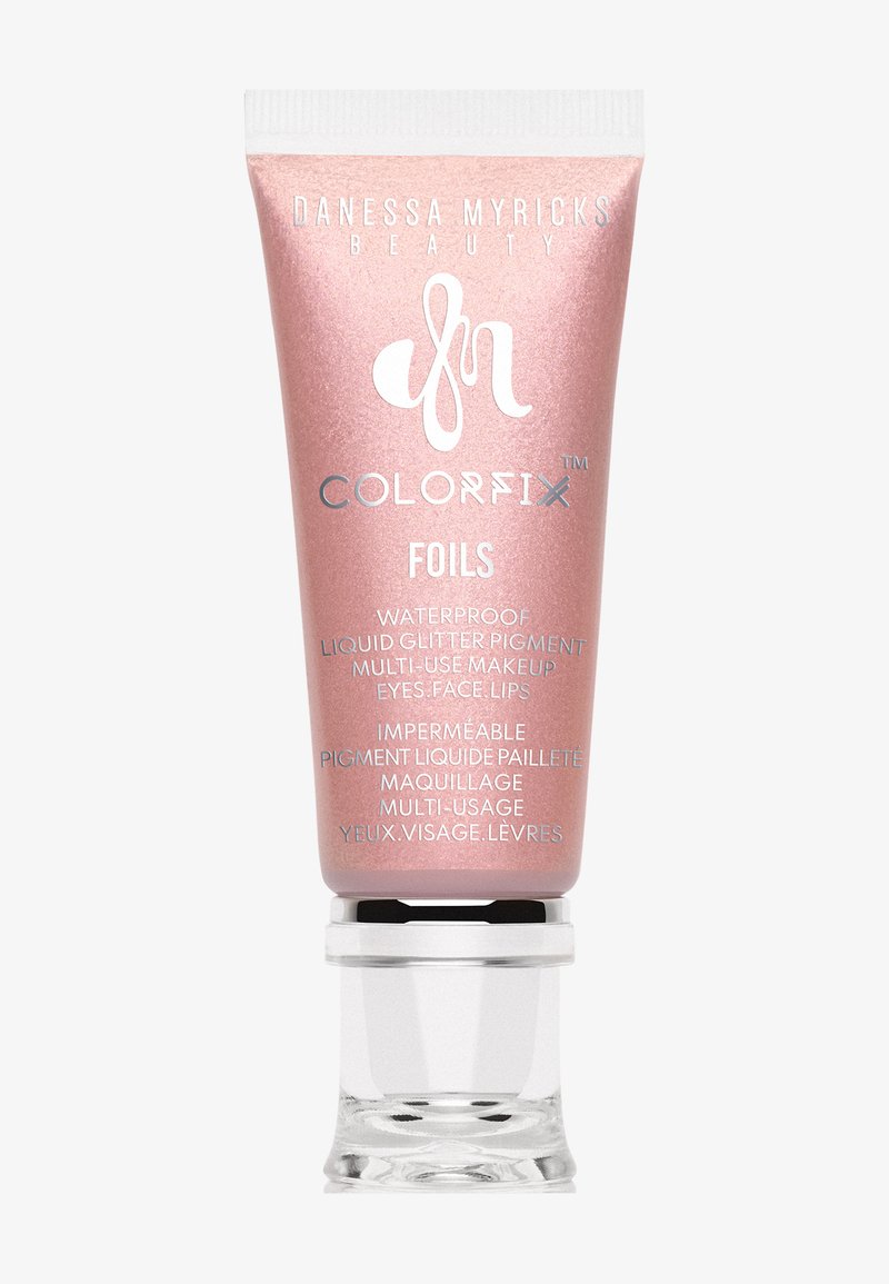 Tubo metallico rosa con un tappo argento, etichettato "Colorfix Foils," che mostra i dettagli del prodotto e le istruzioni in inglese e francese. Pigmento glitter impermeabile.