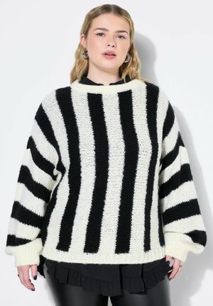 Maglione a righe bianco e nero in maglia con scollatura ampia, vestibilità oversize e maniche lunghe. La trama è morbida, con polsini e orlo a coste.