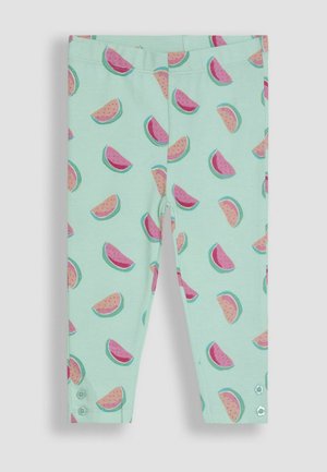 Vihreät leggingsit, joissa on vesimeloniviipaleiden kuvio pinkissä ja sinisessä. Eleganssia tuovat napit lahkeissa. Valmistettu pehmeästä ja joustavasta materiaalista.