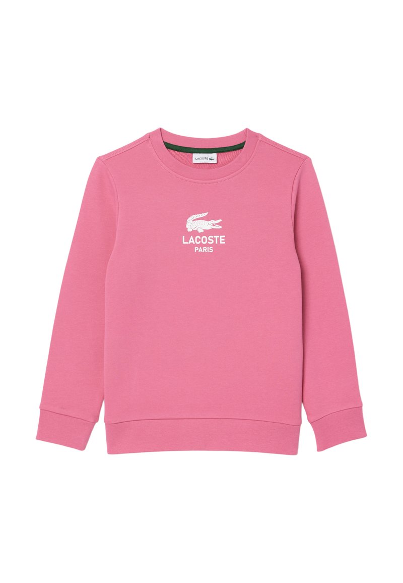 Rosa Sweatshirt aus weichem Material, mit Rundhalsausschnitt, langen Ärmeln und einem weißen Lacoste-Logo mit "PARIS" darunter.