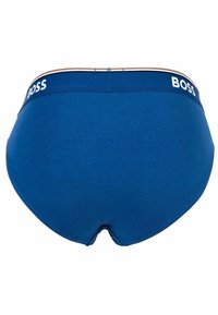 Mutande di cotone blu con una texture liscia, dotate di una fascia con marchio color navy con "BOSS" in bianco. Design classico a slip.