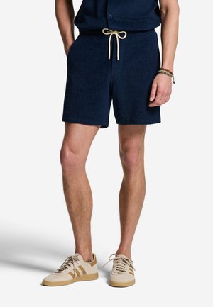 The Sunshine Brand, Shorts - blue navy tropic leaves