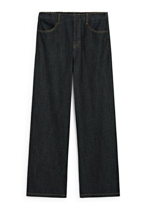 Dark denim jeans with a wide-leg cut, featuring two front pockets and contrasting yellow stitching along seams and waistband.