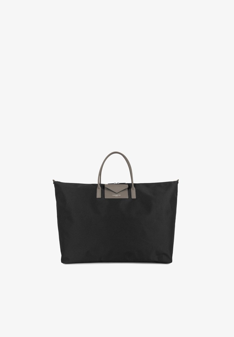 Grand sac cabas noir avec de courtes poignées grises et une petite poche avant à rabat, présenté sur fond blanc.