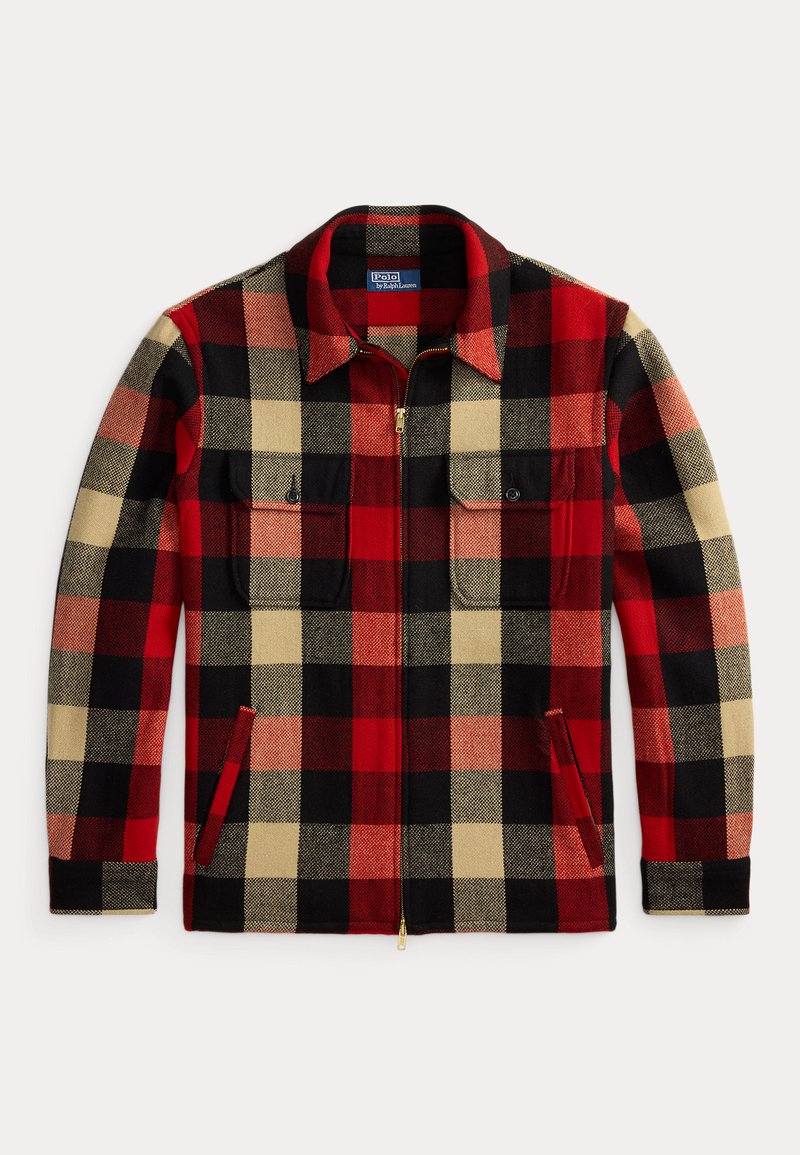 Rood, zwart en beige geruite flanellen jas met een ritssluiting aan de voorkant, twee borstzakken en zijzakken. Beschikt over een puntige kraag en een gestructureerde stof.