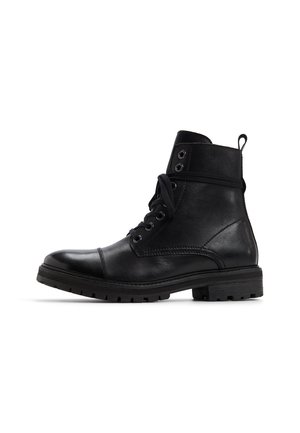Black leather ankle boot with a smooth texture, round toe, and lace-up front. Features metal eyelets and a reinforced rubber sole.