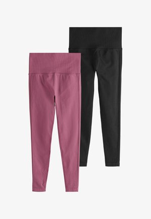 Kaks paari hästi vormitud sportlikke retuuse: üks tume roosa soonikkoes vöökohaga, teine täiesti must sileda vöökohaga.