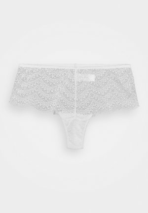 Witte kanten string met een golfdesign, verfijnde patronen en een zachte textuur. Verstelbare tailleband met een naadloze afwerking.