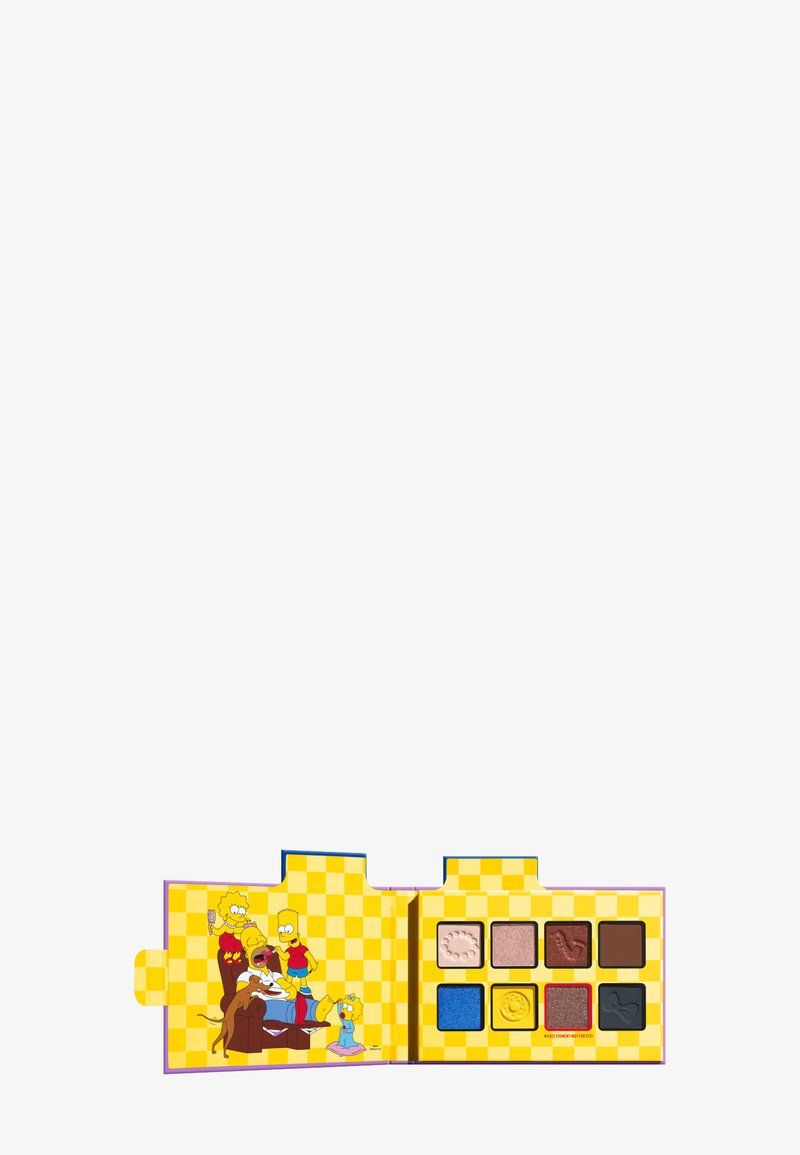 Eyeshadow palette with eight colorful shades, open case featuring The Simpsons family sitting on a brown couch against a yellow checkerboard background.