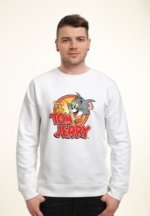 Biała bluza z nadrukiem w kolorach z postaciami z "Tom i Jerry", prezentująca bohaterów kreskówki, wyraźny napis oraz ściągacze przy rękawach.