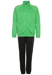 Veste de sport verte à fermeture éclair avec poignets élastiques, associée à un pantalon de sport noir, présentée sur un fond blanc.