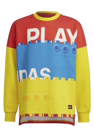 Langærmet sweatshirt med røde, blå og gule blokke, der ligner LEGO-klodser, og ordet "PLAY" delvist synligt foran.