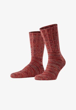 Calze a maglia a righe rosse e grigie, lunghezza a metà polpaccio, con texture a costine e gambo e punta rinforzati. Finitura in filato morbido per il calore.