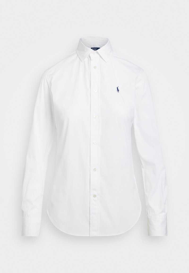 Bílá košile na knoflíky s špičatým límcem, dlouhými rukávy a malým modrým logem na levé straně hrudi. Vyrobena z bavlněné tkaniny.