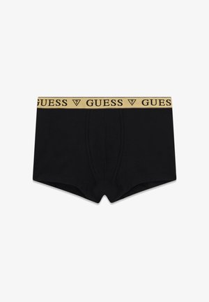 Černé boxerky z bavlny s žlutým elastickým pasem nesoucím černé logo 'GUESS'. Standardní zapínání na předním díle s přiléhavým střihem.