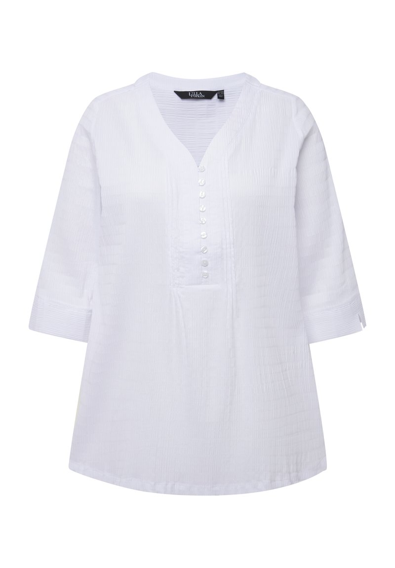 Witte tuniektop met een V-hals, knopenfront met ronde knopen, driekwartmouwen, textuurstof en een ruime pasvorm.