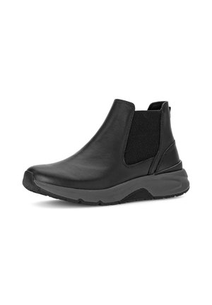 Black slip-on ankle boot with a rounded toe, elastic side panel, and thick textured sole, photographed on a white background.