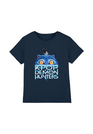Navy blue T-shirt with a graphic of large yellow cat eyes, a black bird wearing a hat above, and text "K-Pop Demon Hunters."