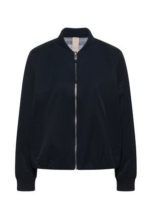 Laivastonsininen bomber-takki, jossa etulukko, resorit kauluksessa ja hihansuissa, sivutaskut sekä pieni vetoketjullinen tasku vasemmassa hihassa.