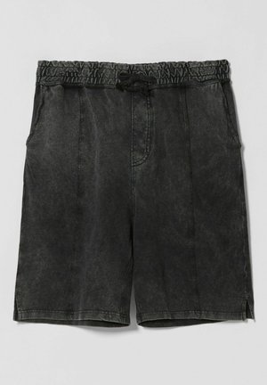 Schwarze, ausgewaschene Shorts mit Kordelzug, elastischem Bund, Seitentaschen und dezenten vertikalen Nahtdetails.