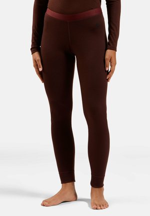 Brown thermal leggings with a contrasting waistband. Fitted design, stretchy material, and no visible patterns or logos. Barefoot model.