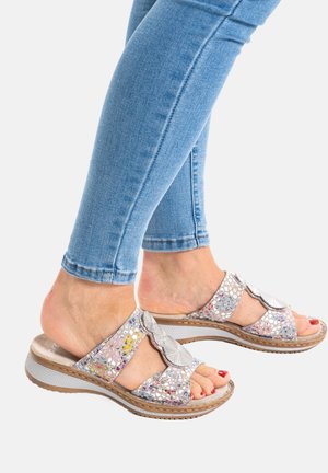 Silver slide sandals with a textured upper featuring colorful rhinestones. Cushioned sole with a patterned edge, visible toe and heel.