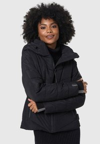 Black puffer jacket with a hood, featuring quilted texture, zipper front, and contrasting gray cuffs. Lightweight and insulated design.