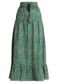 Jupe longue verte présentant un motif géométrique de triangles noirs et blancs, ourlet à volants à étages, taille élastique avec cordon de serrage.