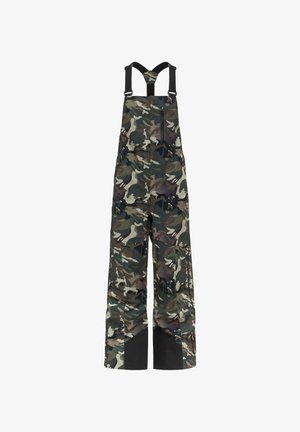 Pantalon salopette imperméable à motif camouflage avec renforts noirs aux genoux et aux chevilles et bretelles noires réglables.