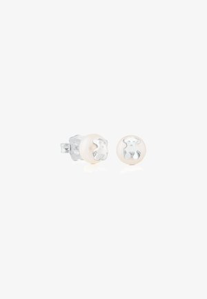 Perlen-Stud-Ohrstecker mit silbernem Hundegesicht-Design. Runde Perlenbasis in sanftem Weiß; das silberne Detail zeigt ein erhabenes, stilisiertes Hundegesicht.