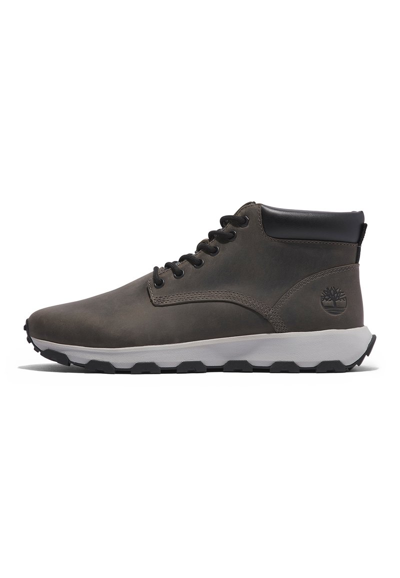 Gray leather ankle boots with black accents, textured surface, lace-up design, and a white rubber sole with black tread. Classic branding on side.