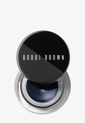 Pieni pyöreä lasiastia tummansinisen geelieyelinerin kanssa ja musta kierrekorkki, jossa lukee Bobbi Brown.