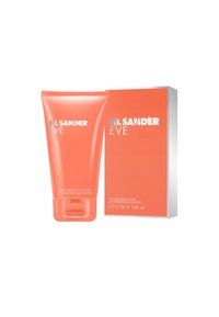 Korallrør med Jil Sander Eve parfymerte kroppslotion (150 ml) med glatt tekstur og sølvfarget skrift, ved siden av en matchende korallbokse med hvit tekst.
