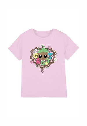 Light pink short-sleeve t-shirt featuring a central cartoon character surrounded by text, flowers, and vine-like accents in vibrant colors.