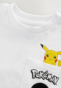 Unselected, white back print