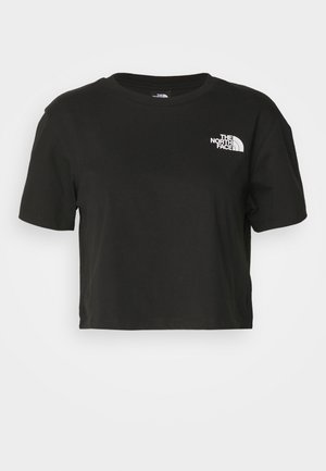 T-shirt cropped preto feito de algodão. Apresenta um decote redondo e mangas curtas, com um logótipo branco na área esquerda do peito.