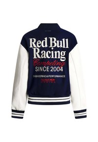 Marineblå og hvit collegejakke med Red Bull Racing-tekst og logo, med "Competing Since 2004" brodert på baksiden.