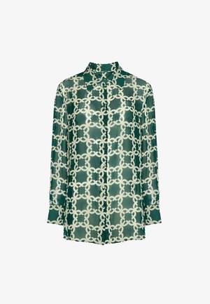 Doorzichtige groene blouse met een ingewikkeld wit geometrisch kettingpatroon, knoopsluiting aan de voorkant, lange mouwen en een klassieke kraag.