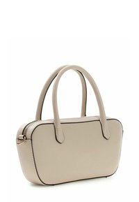 Sac à main synthétique beige avec deux poignées arrondies, forme rectangulaire, fermeture éclair, et bordure noire contrastante le long des coutures.