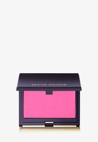 Kevyn Aucoin blushkompakt med ett mörkt lila fodral och guldaccenter, med en texturerad ljusrosa blush inuti.