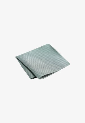 Tissu texturé vert clair plié en deux, présentant un motif tissé avec une finition douce, adapté à diverses applications textiles.