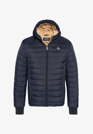 Granatowa kurtka puchowa z zamkiem z przodu, miękką beżową podszewką z polaru i kapturem. Posiada pikowaną zewnętrzną tkaninę oraz mankiety przy rękawach.