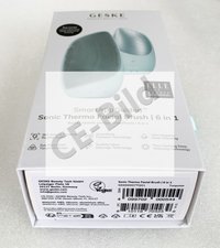 Brosse faciale thermique Sonic en turquoise, avec une forme courbée, une surface en silicone au design texturé et des fonctionnalités étiquetées 6 en 1.
