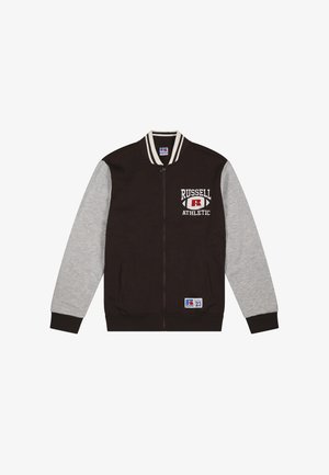 Giacca varsity nera e grigia con zip, logo "Russell Athletic" sul petto, colletto a righe e toppa vicino all'orlo.