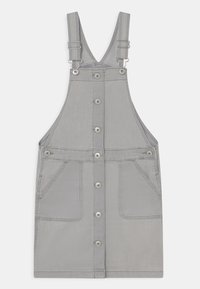 Grå denimoverallklänning med justerbara band, knäppning fram och två rymliga sidofickor. Slät textur och minimalistisk design.