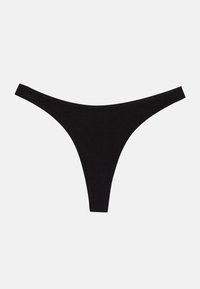 Black thong underwear made of soft, stretchy fabric. Features a minimalistic design with thin waistband and string sides.